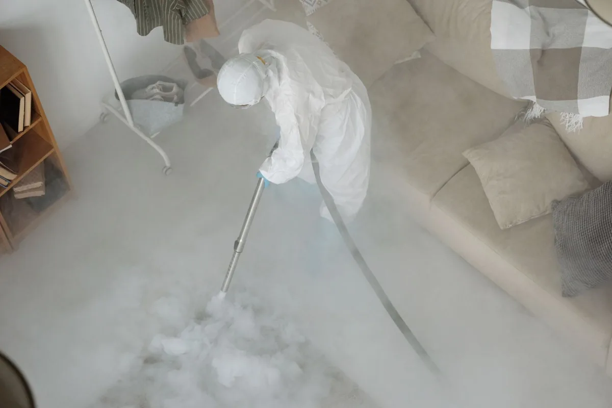 Biohazard cleanup technician in protective equipment, Silver Lake, OH